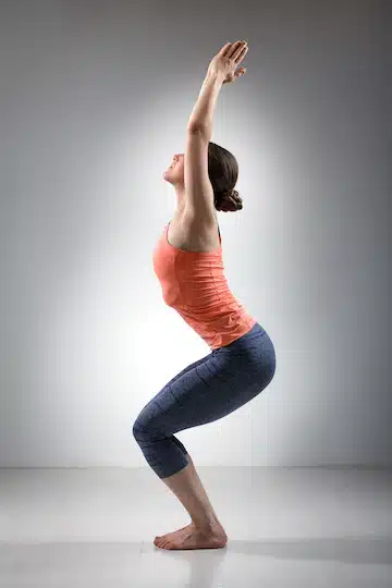 woman doing ashtanga vinyasa yoga asana utkatasana 163782 4805